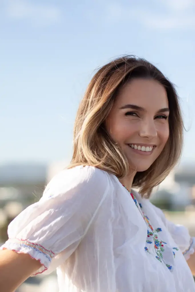 Abbi Berry smiling and look over shoulder